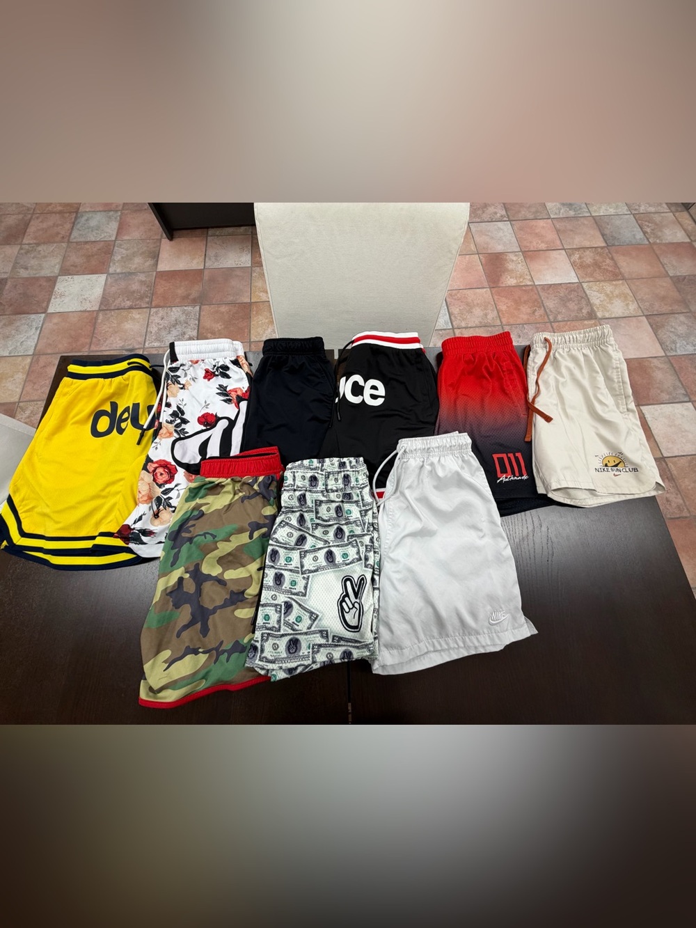 Nine pairs of size small basketball shorts